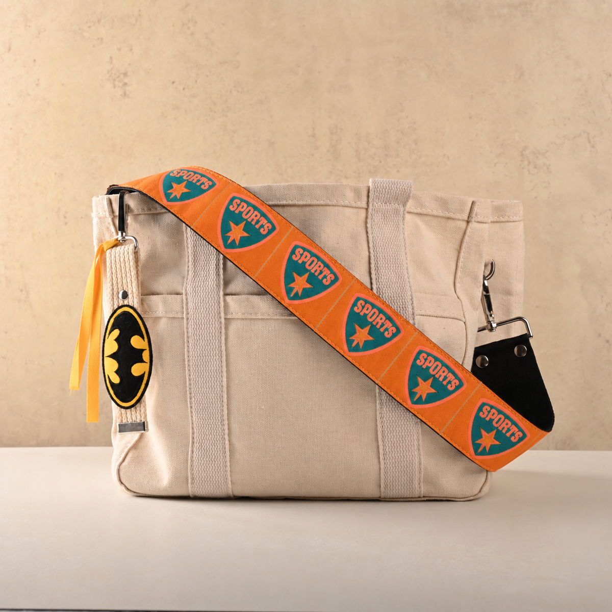 Tangerine Sports Shield Bag Sling with Bat Charm