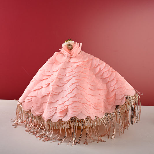 Peach thaal cover, front view on red backdrop